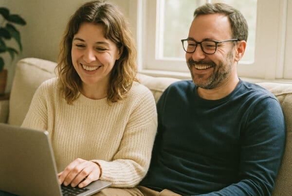 Service Center - Happy Couple Using Laptop at Home